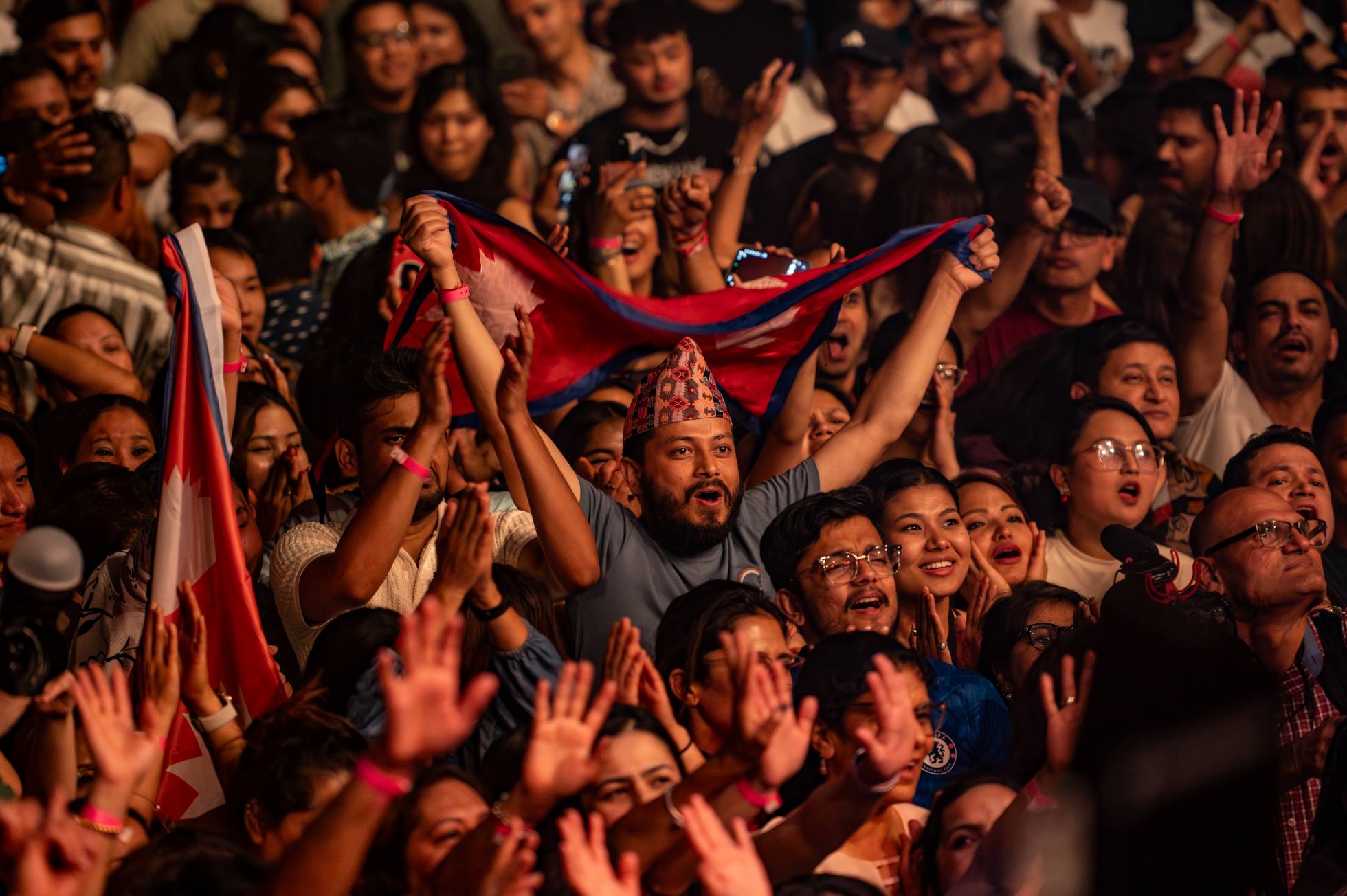 03-Audience-wave-national-flag-at-the-Nepathya-concert-in-Boston.-Photo---Monsoon-Shrestha---nepalaya-1749827282.jpg