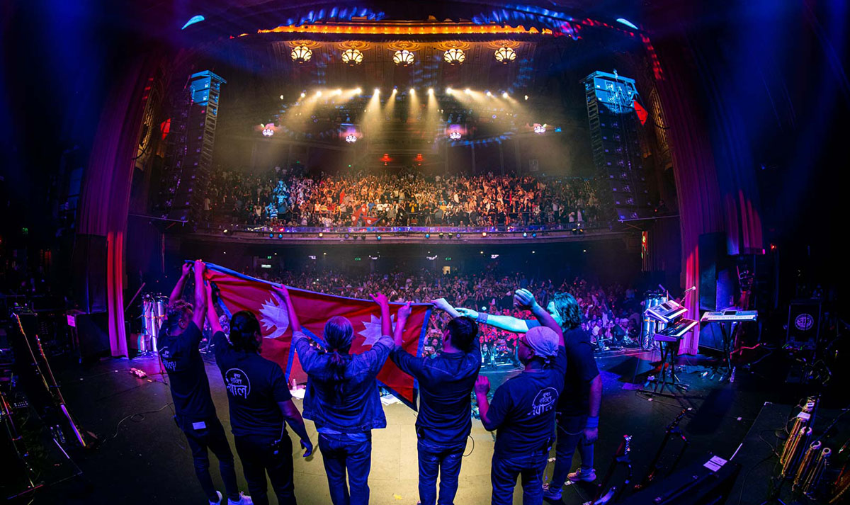 03-Nepathya-members-raising-the-national-flag-during-their-performance-in-San-Francisco.-Photo-Dipit-Raz-1723472618.jpg