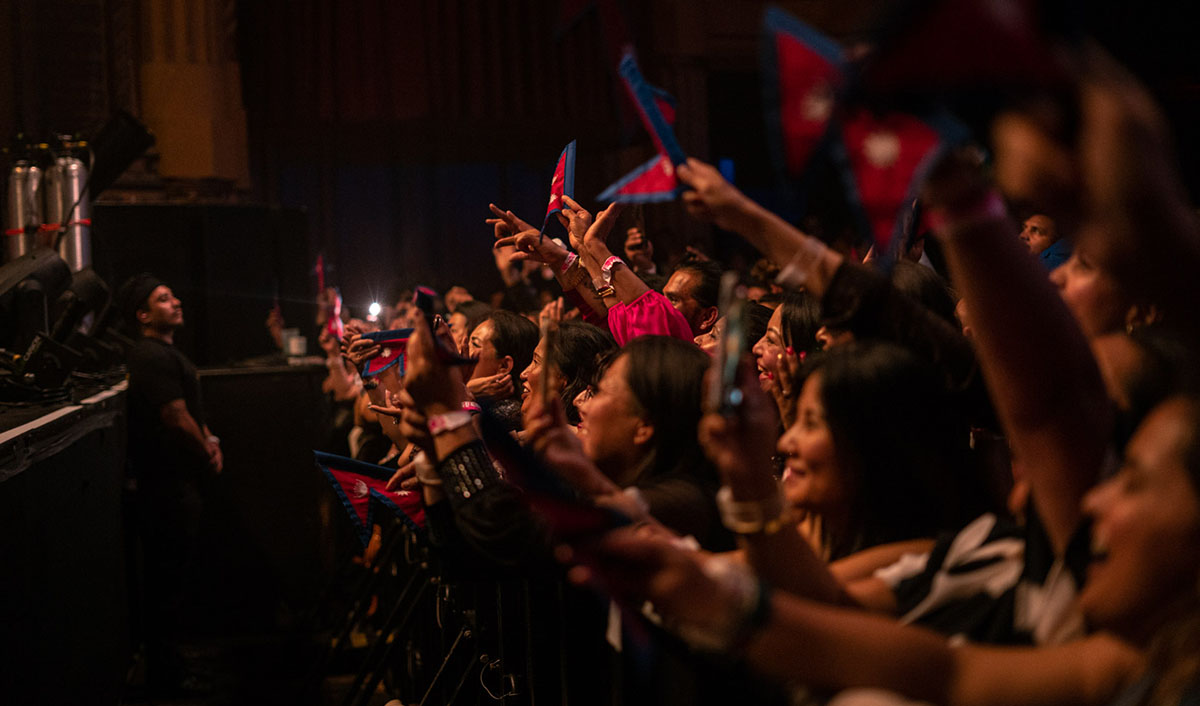 09-Nepathya-audience-raise-the-Nepali-flag-in-support-of-the-band's-performance-in-San-Francisco.-Photo-Dipit-Raz-1723472617.jpg