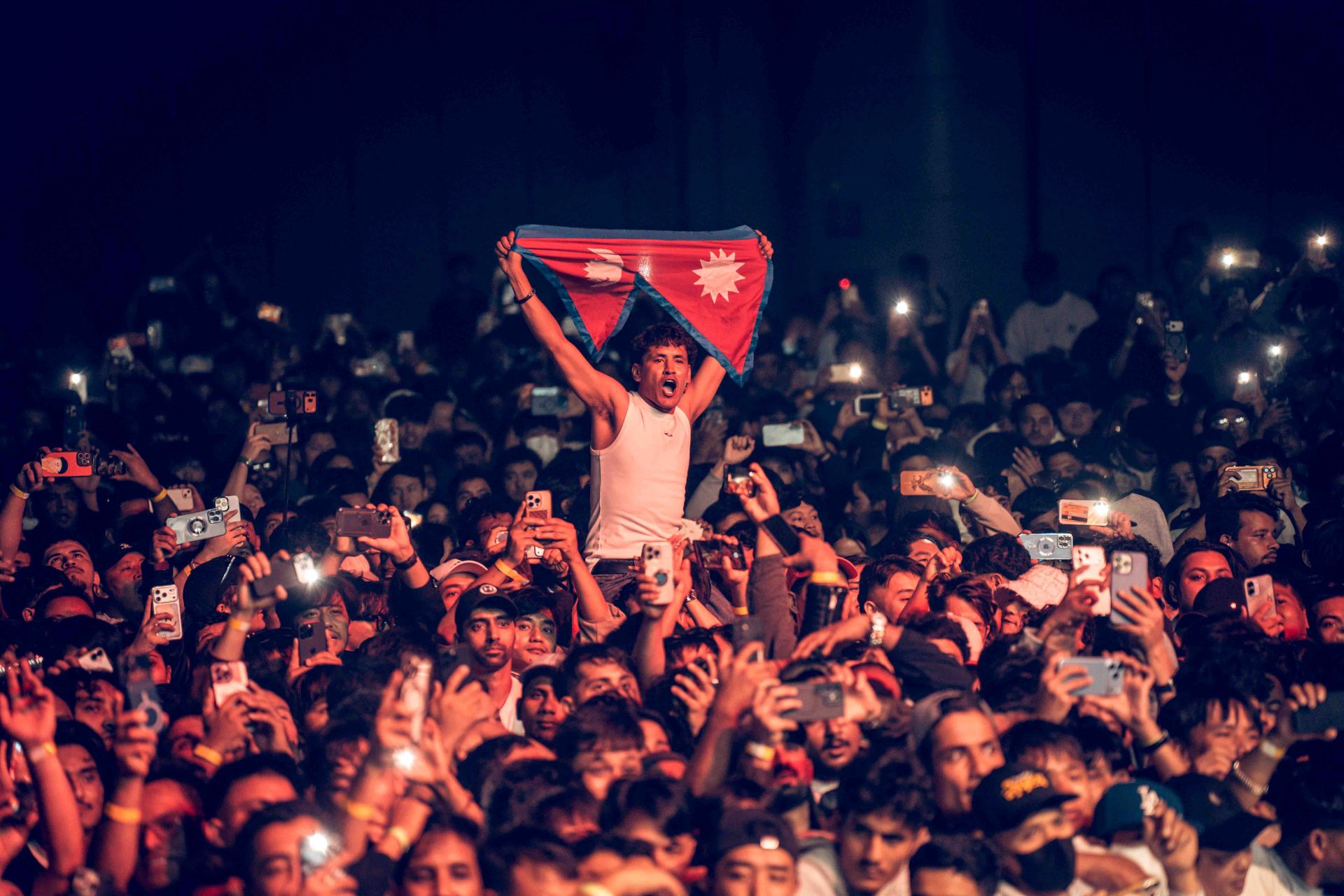 13-An-audience-raises-Nepal's-flag-at-the-Nepathya-Concert-in-Seoul.-Photo---Dipit-Raz---nepalaya-1790589671.jpg